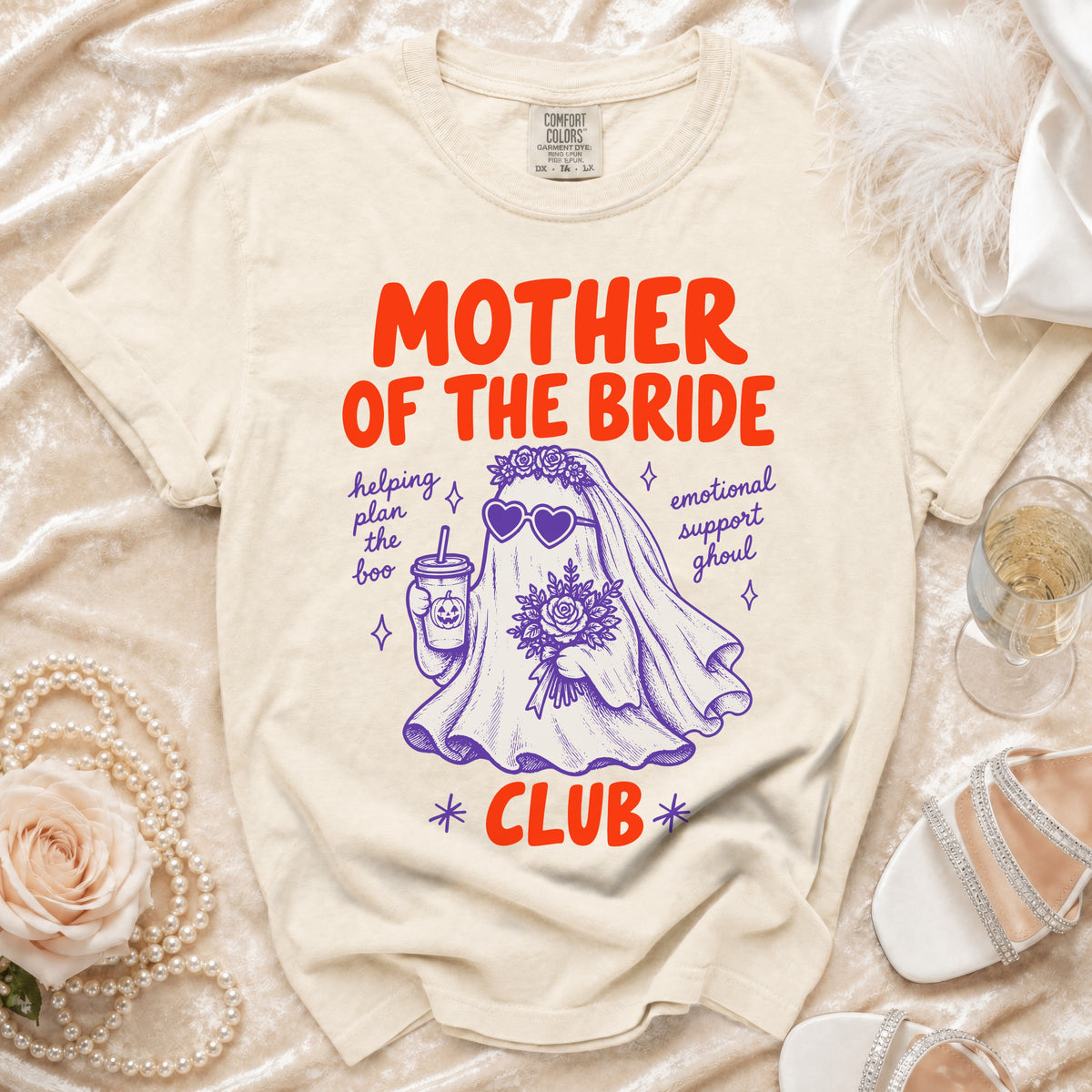 T-shirt with "Mother of the Bride Club" text and ghost graphic holding a pumpkin drink.