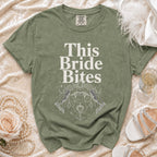Green t-shirt with "This Bride Bites" text and vampire lips graphic.