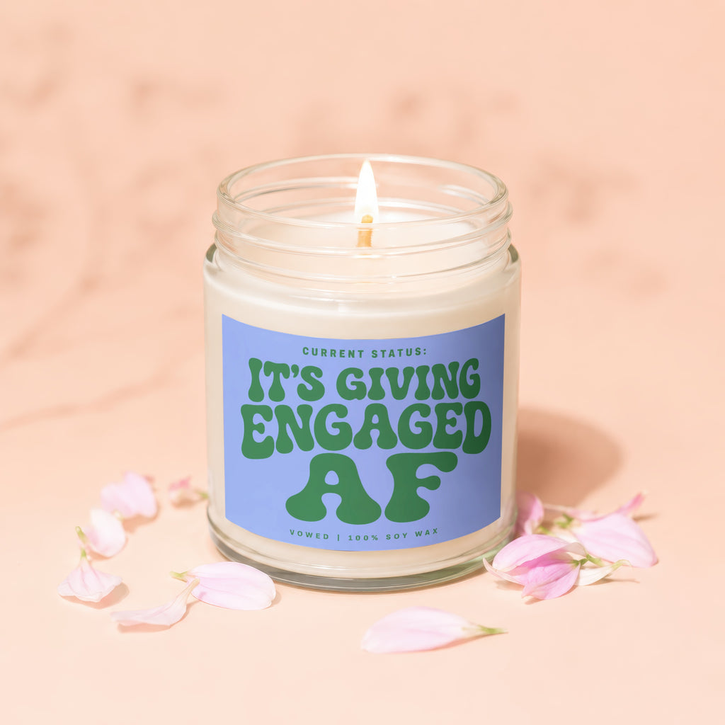 Glass jar candle with "It's Giving Engaged AF" text, Vowed, 100% Soy Wax.