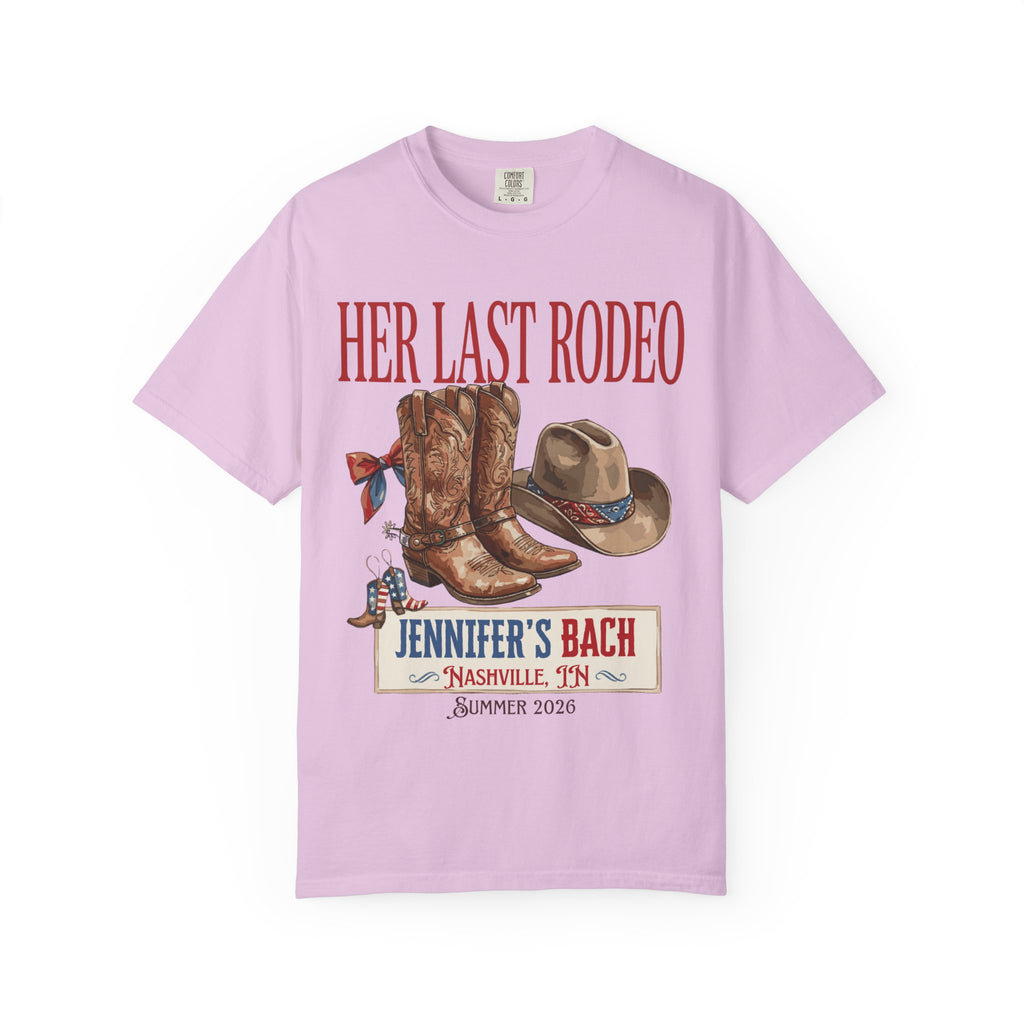 Pink t-shirt graphic with cowboy boots, hat, and "Her Last Rodeo" text.
