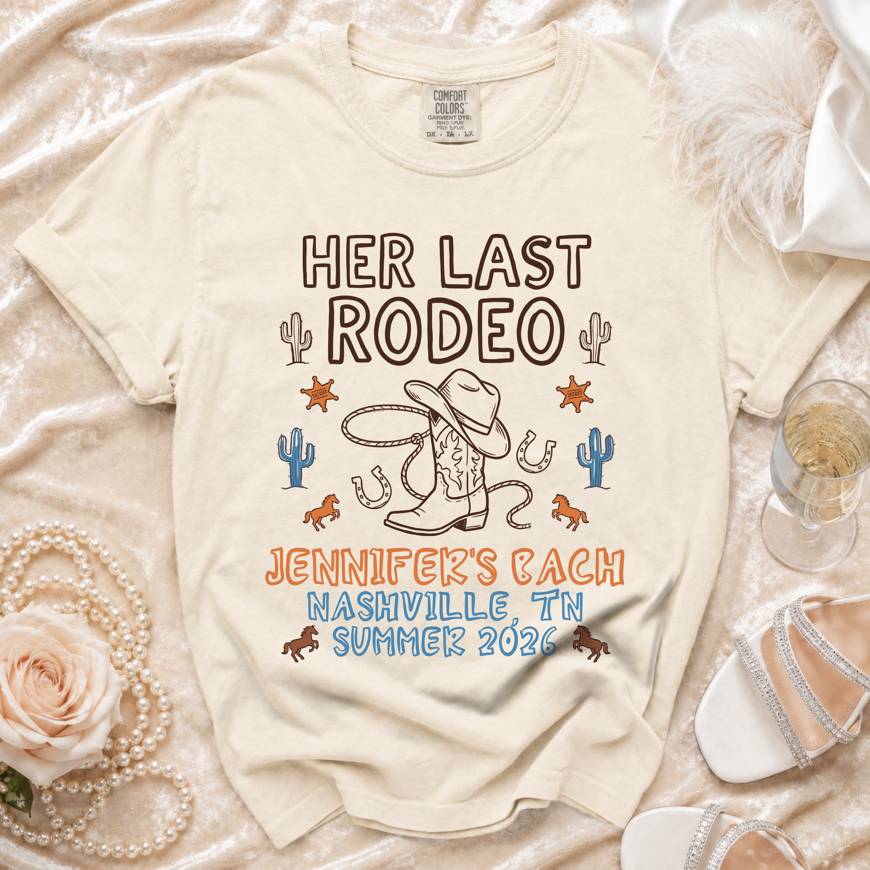 T-shirt with "Her Last Rodeo Jennifer's Bach Nashville TN Summer 2026" text and cowboy elements.