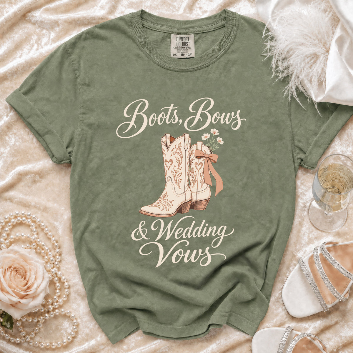 Olive green t-shirt with "Boots, Bows & Wedding Vows" graphic.