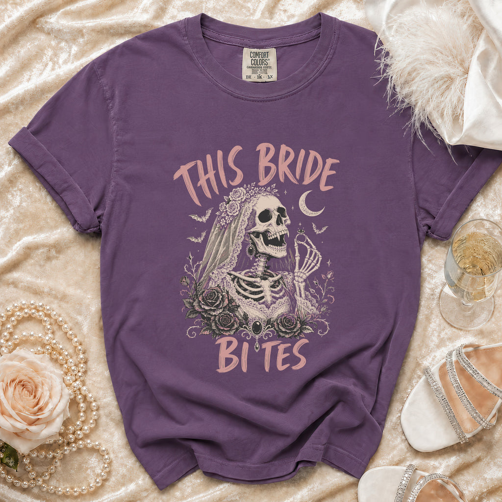 Purple t-shirt with skeleton bride graphic reading "This Bride Bites."