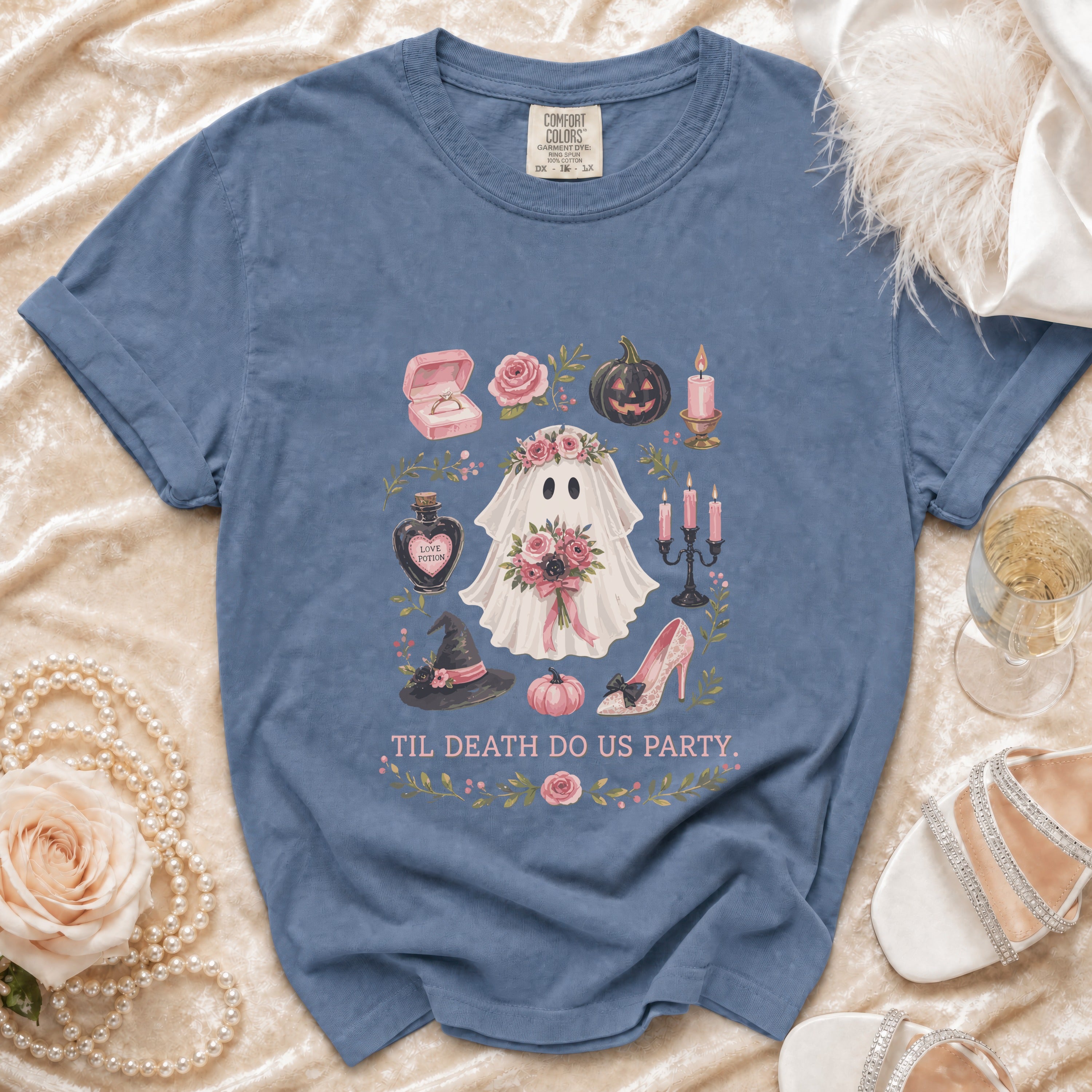 Blue t-shirt with ghost, pumpkins, and wedding ring graphic saying "Til Death Do Us Party."