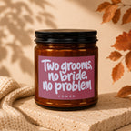 Candle with text "Two grooms, no bride, no problem" and "VOWED".