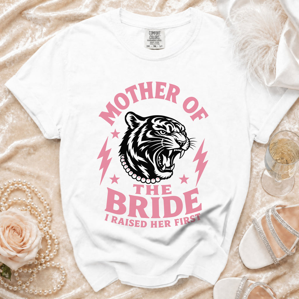 White t-shirt with "Mother of The Bride I Raised Her First" text and tiger graphic.