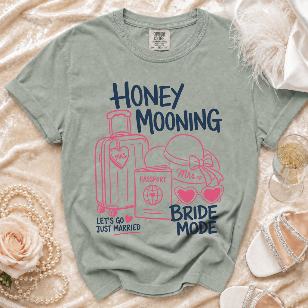 Grey t-shirt with "HONEY MOONING" and "BRIDE MODE" text and graphics.