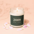Jar candle with "Established 2009 Ruth + Caleb Still Going Strong" label.
