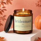 Amber jar candle with the text "bridesmaid" and definition on its label.