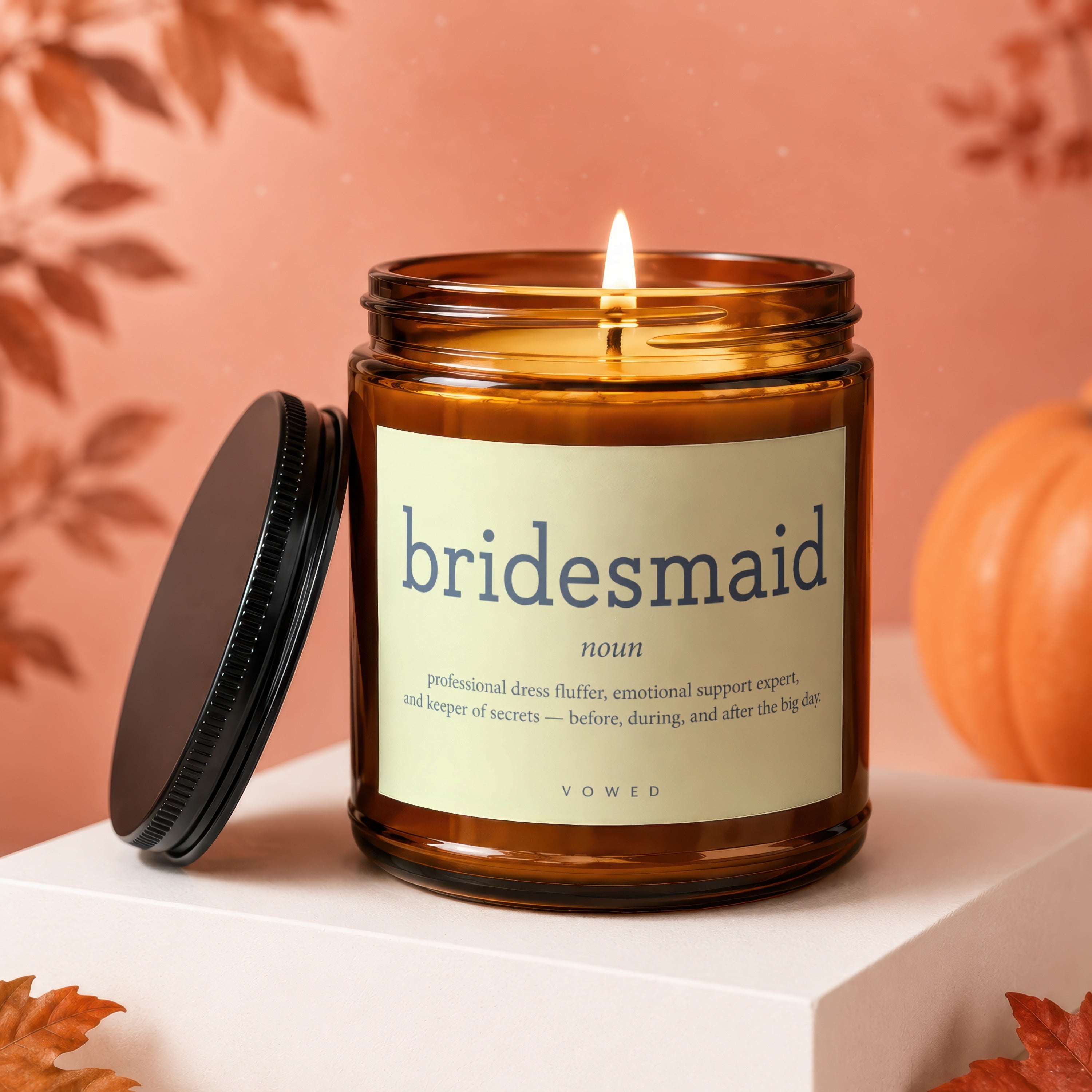 Amber jar candle with the text "bridesmaid" and definition on its label.