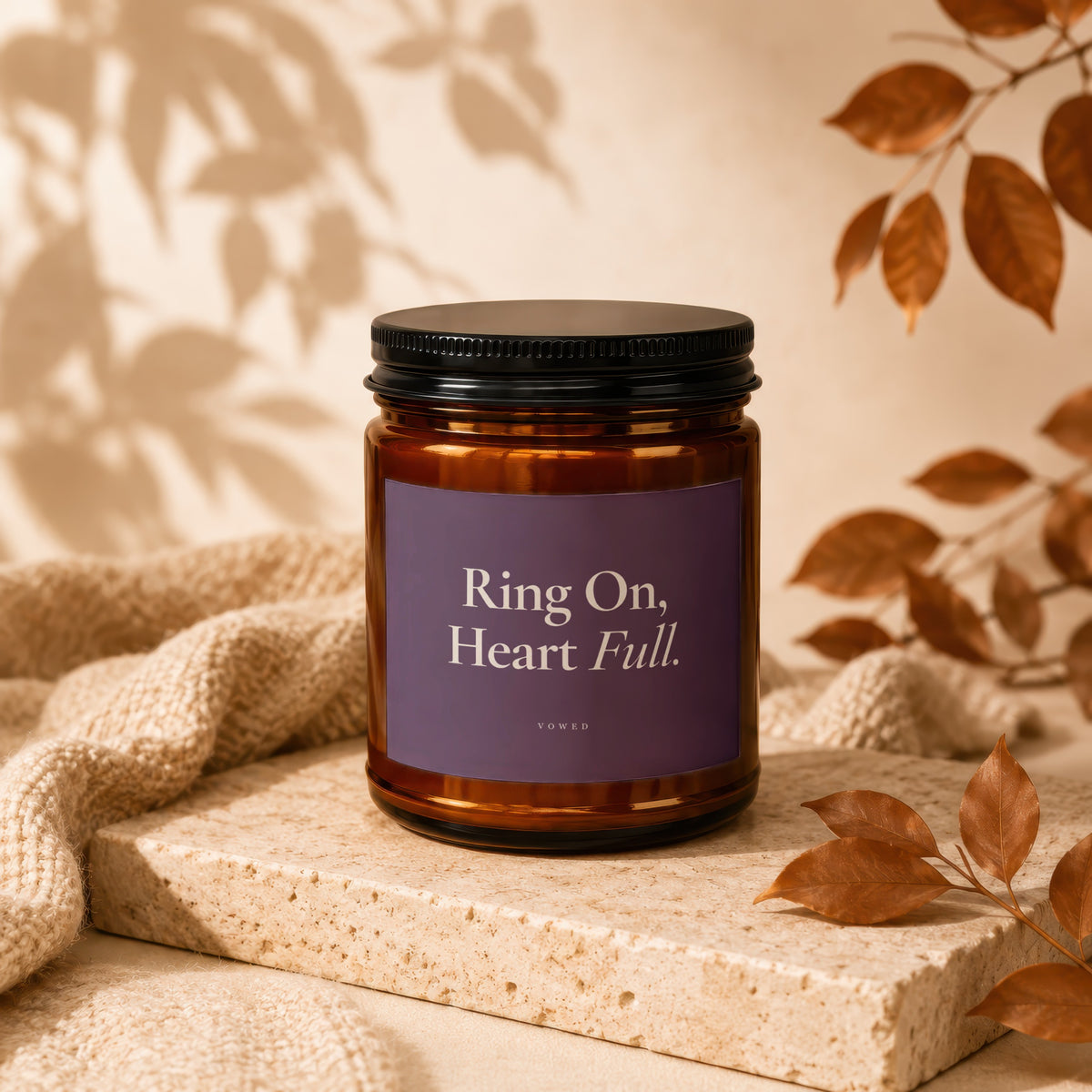 Amber jar candle with purple label reading "Ring On, Heart Full. VOWED."