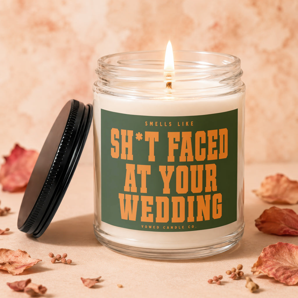 Jar candle with green label reading "Smells Like Sh*t Faced At Your Wedding"