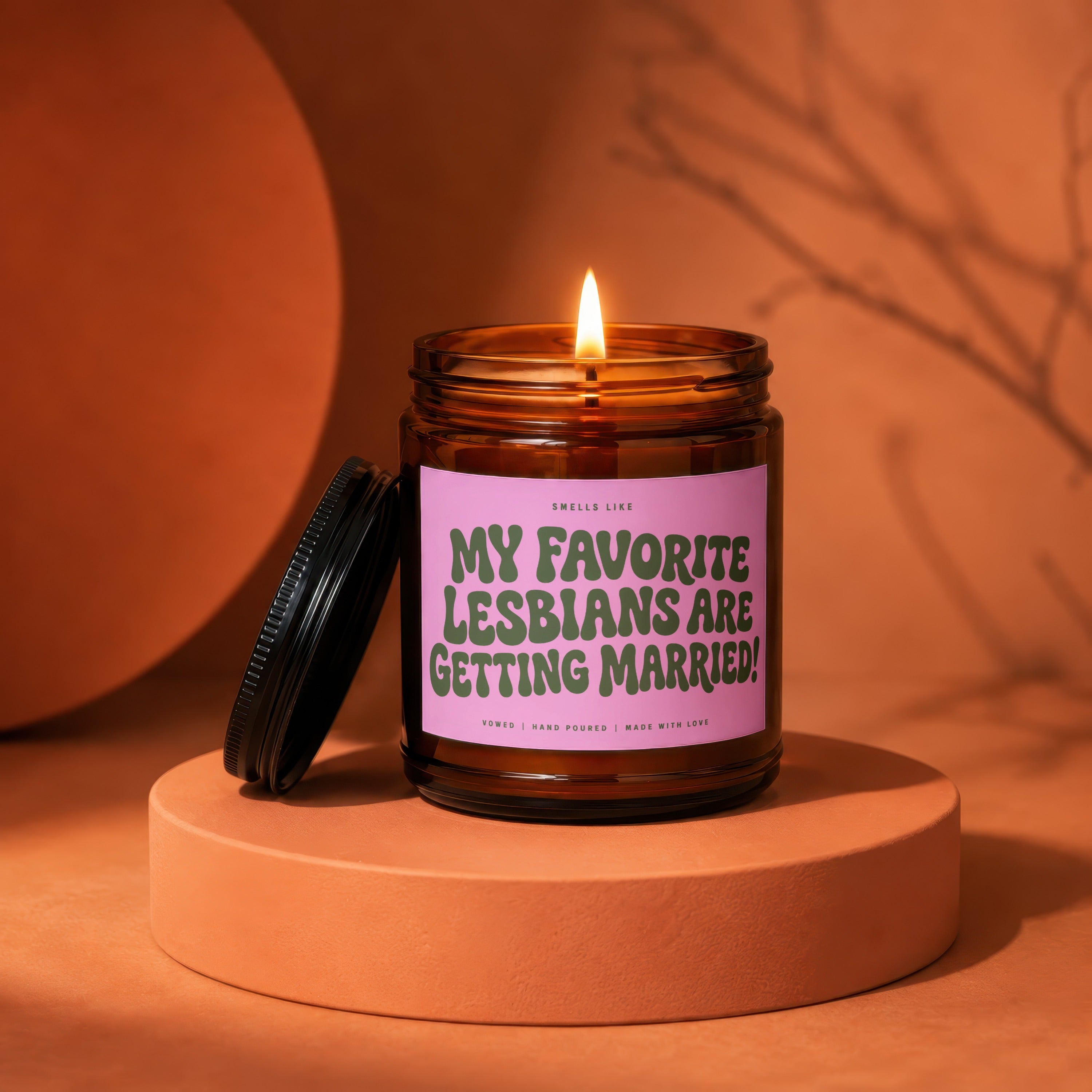 Amber jar candle with "My Favorite Lesbians Are Getting Married!" text.