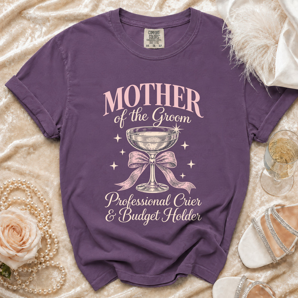 Purple t-shirt with "MOTHER of the Groom Professional Crier & Budget Holder" text.