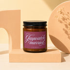 Amber jar candle with magenta label reading "Gaywatch: married VOWED".