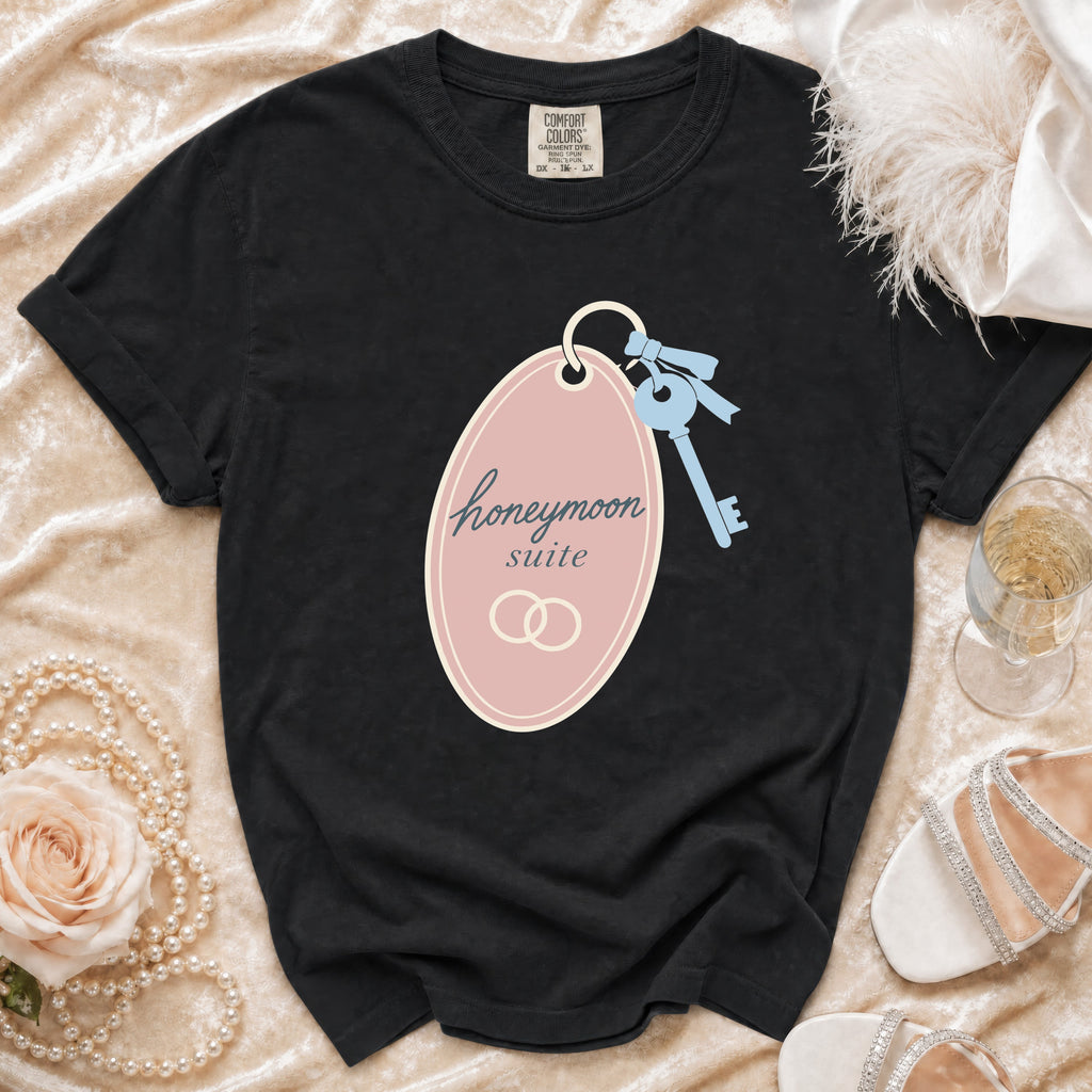 Black t-shirt with "honeymoon suite" text, hotel key, and wedding rings graphic.