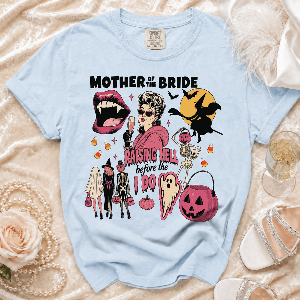 Light blue t-shirt with "Mother of the Bride Raising Hell Before the I Do" graphic.