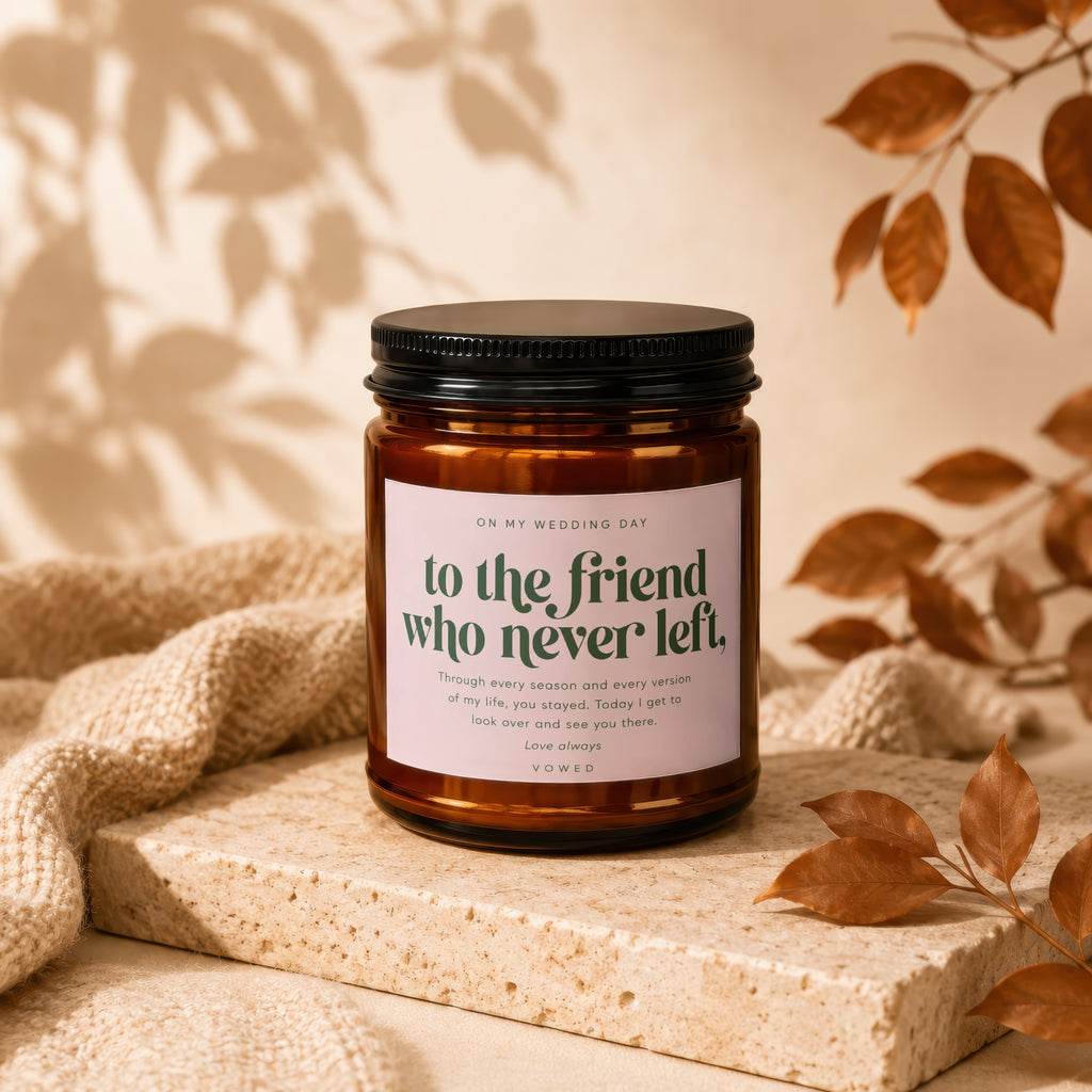 Amber jar candle with black lid, reads "to the friend who never left."
