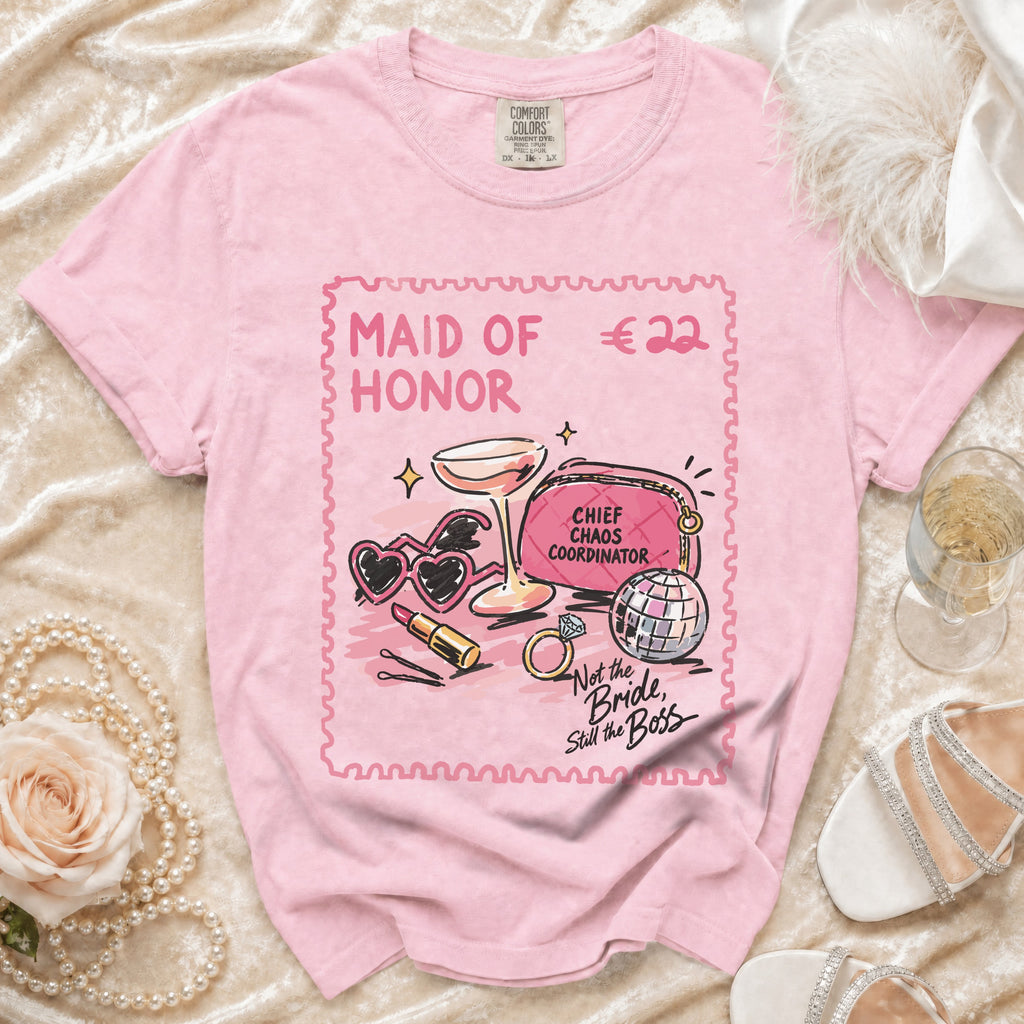 Pink t-shirt with "Maid of Honor" graphic and bridal accessories.