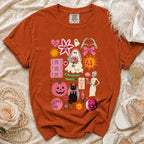 Orange t-shirt with Halloween bride ghost, black cat, pink pumpkin, and spooky text graphics.