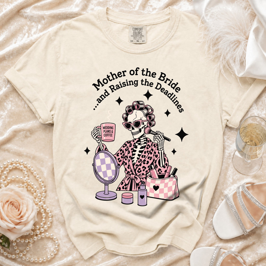 Skeleton graphic on a cream t-shirt reads "Mother of the Bride...and Raising the Deadlines".