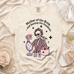 Skeleton graphic on a cream t-shirt reads "Mother of the Bride...and Raising the Deadlines".