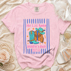 Pink t-shirt with "Her Last Rodeo Jennifer's Bach Nashville, TN Summer 2026" and cowboy boots.