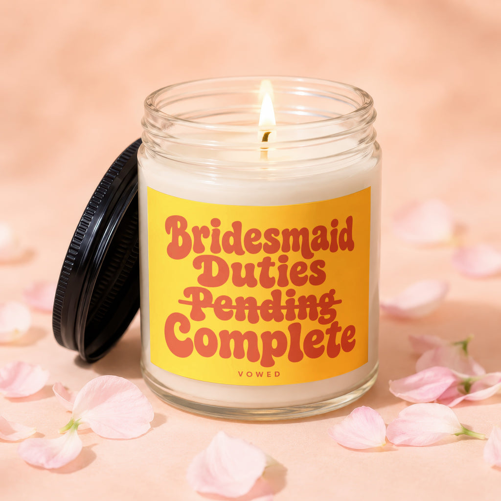 Candle with "Bridesmaid Duties Pending Complete" text on a yellow label.