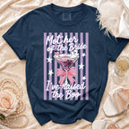 A navy blue t-shirt with a pink-striped graphic featuring a martini glass, ghost, and the text Mother of the Bride I've raised the Boo.