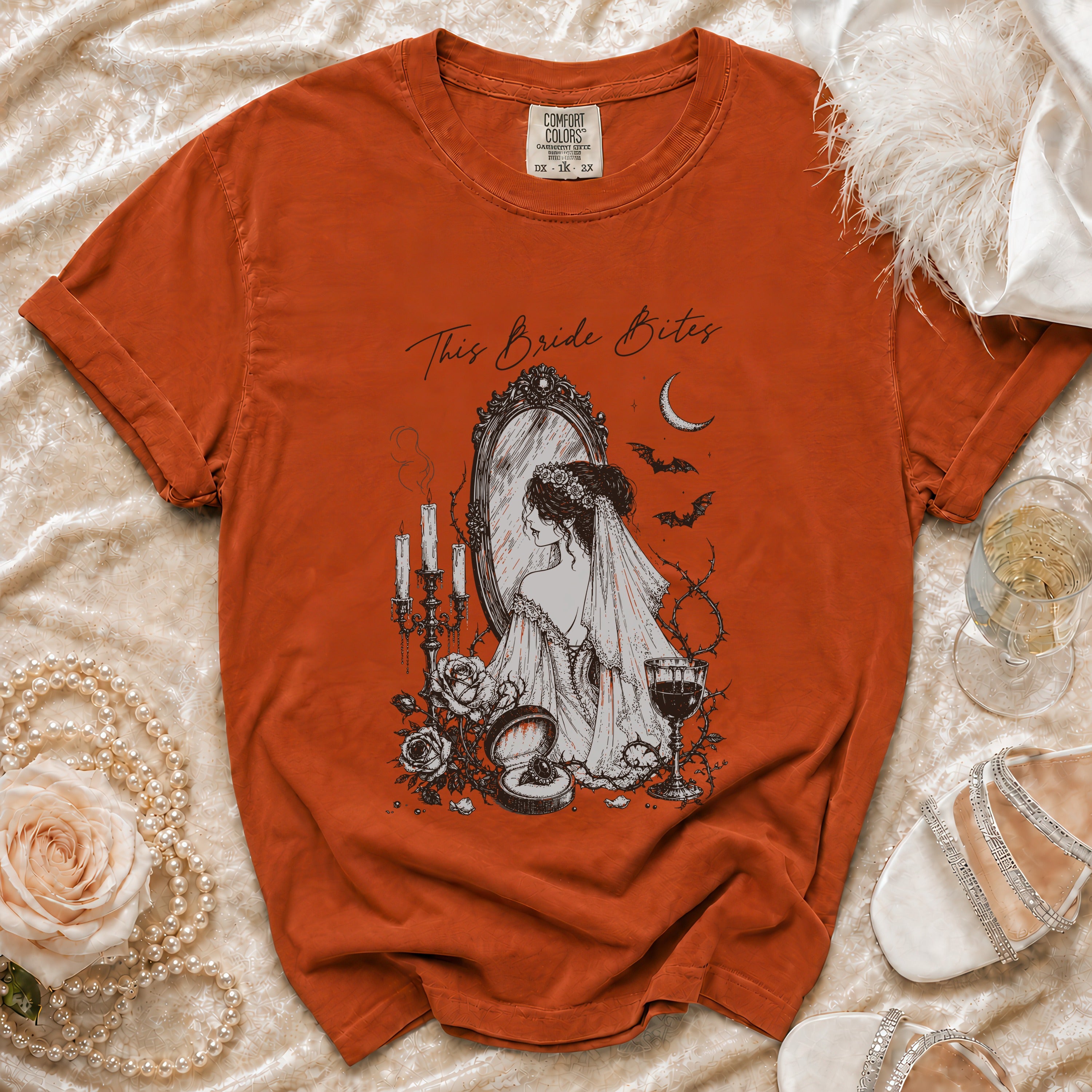 Orange t-shirt with "This Bride Bites" text and gothic bride graphic.