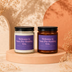 Two candles with purple labels reading "Welcome to Your Pre-Wedding Era."