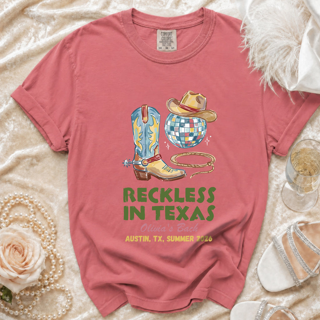 T-shirt with cowboy boot, hat, disco ball, and "Reckless in Texas Olivia's Bach" text.