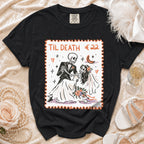 Black t-shirt featuring a stamp-style graphic of a skeleton couple dancing with the text TIL DEATH.