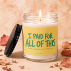 Candle with lid off, displaying text "I paid for all of this and I would do it again".