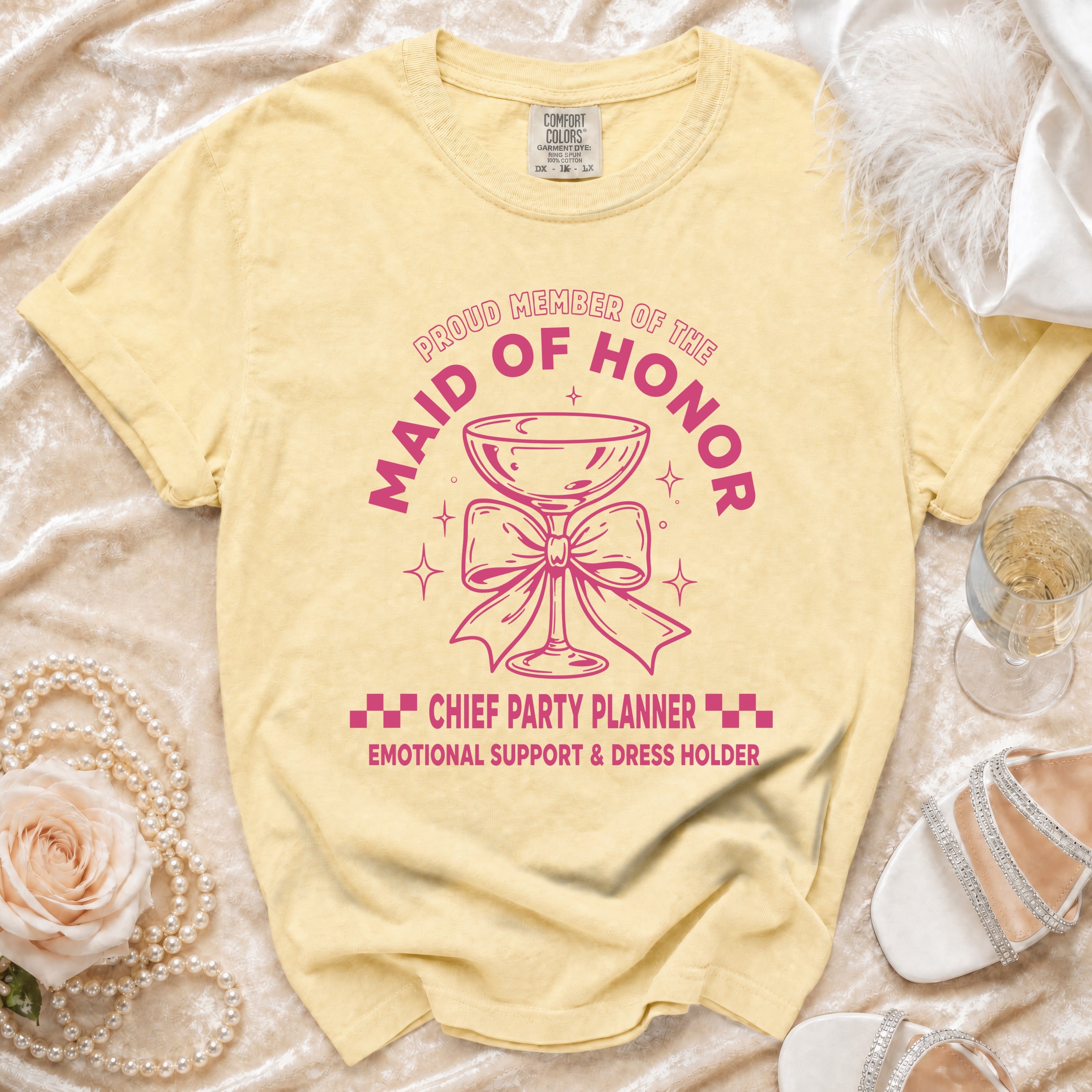 Yellow t-shirt with "Proud member of the Maid of Honor" text and graphic.