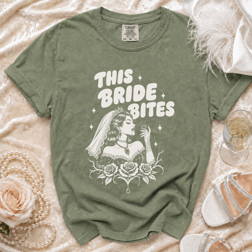 Olive green t-shirt with "This Bride Bites" graphic featuring a bride with roses.