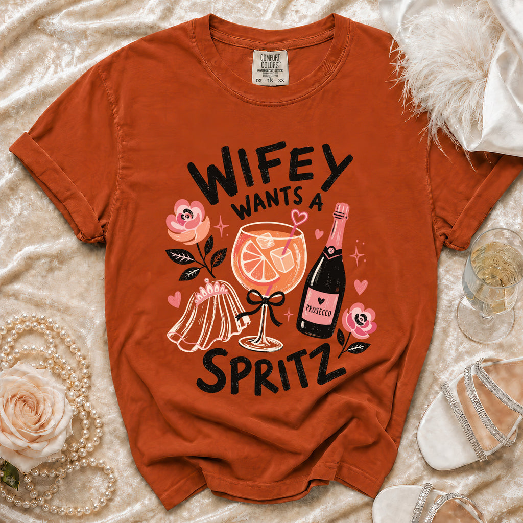 Orange t-shirt with "Wifey Wants a Spritz" graphic featuring a cocktail and prosecco.