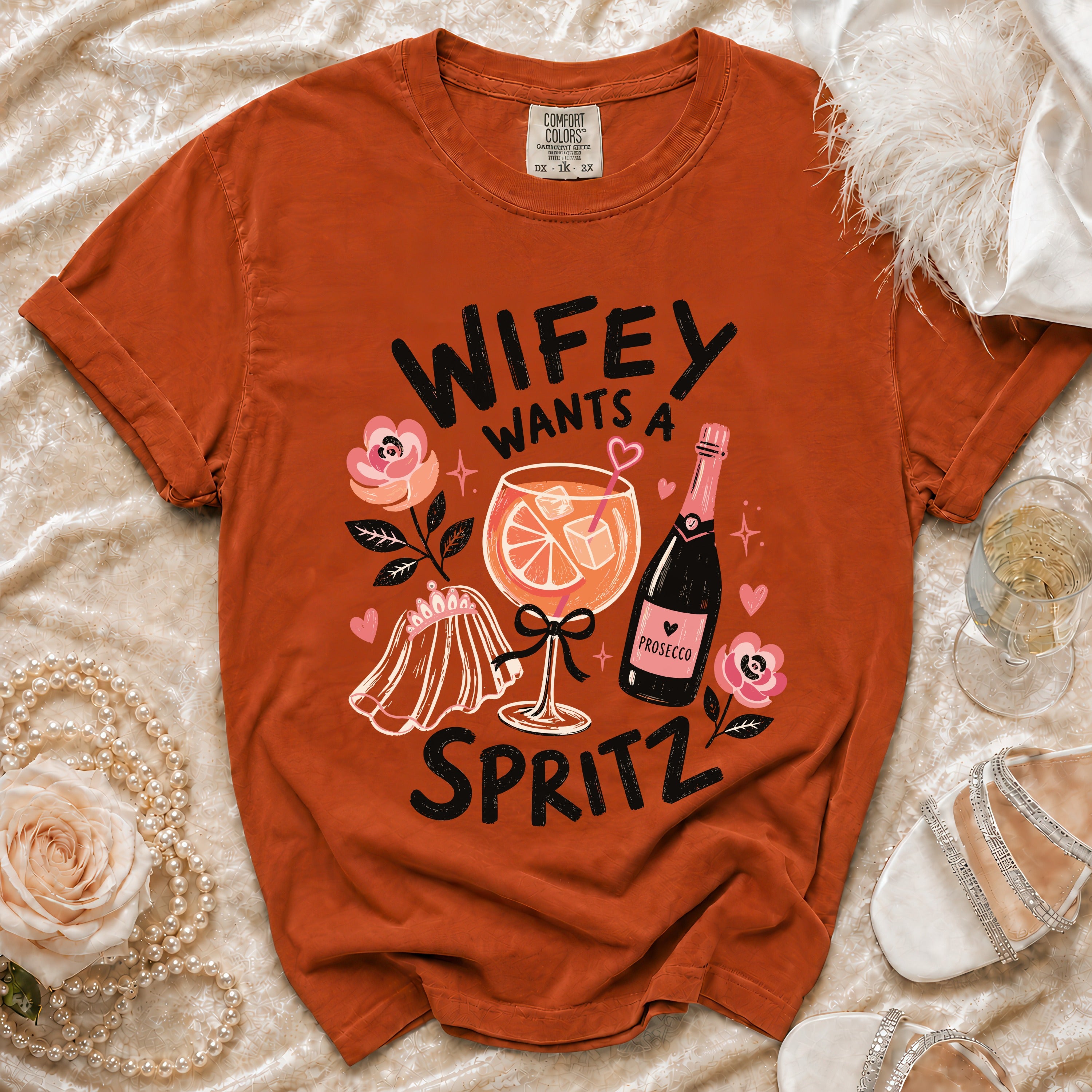 Orange t-shirt with "Wifey Wants a Spritz" graphic featuring a cocktail and prosecco.