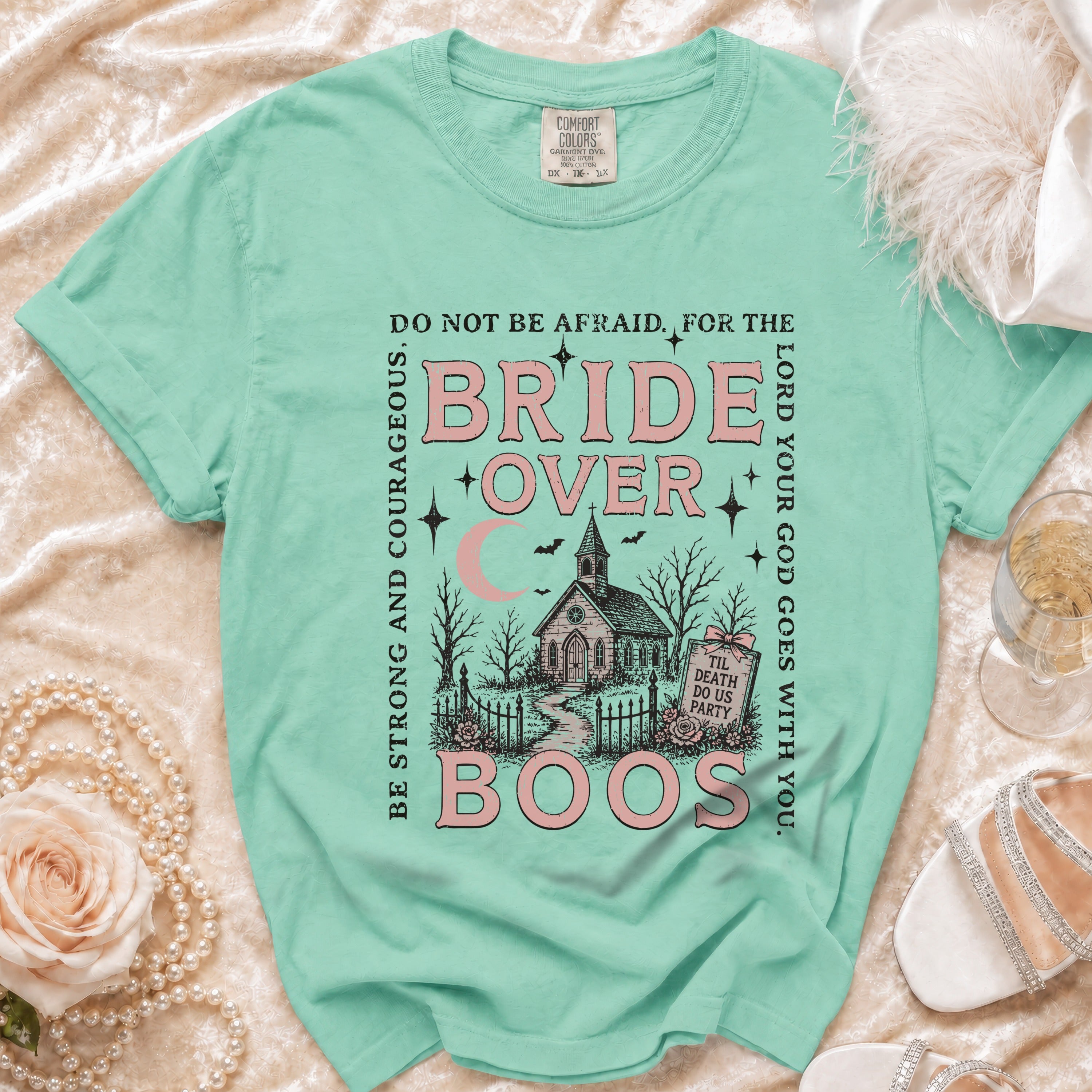 Mint t-shirt with "Bride Over Boos" graphic, a church, and biblical text.