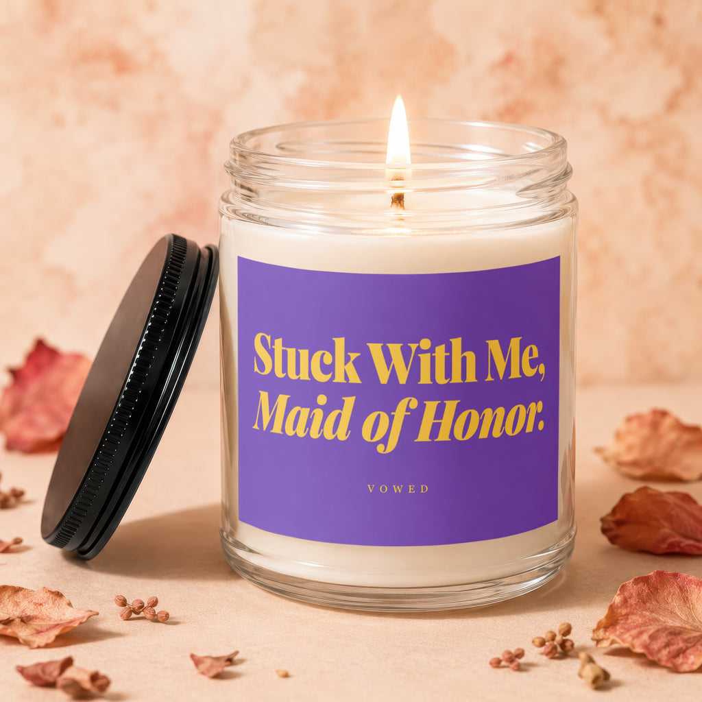 Jar candle with purple label reading "Stuck With Me, Maid of Honor"