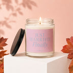 Glass candle with label reading "JUST MARRIED. Finally." on a pedestal.