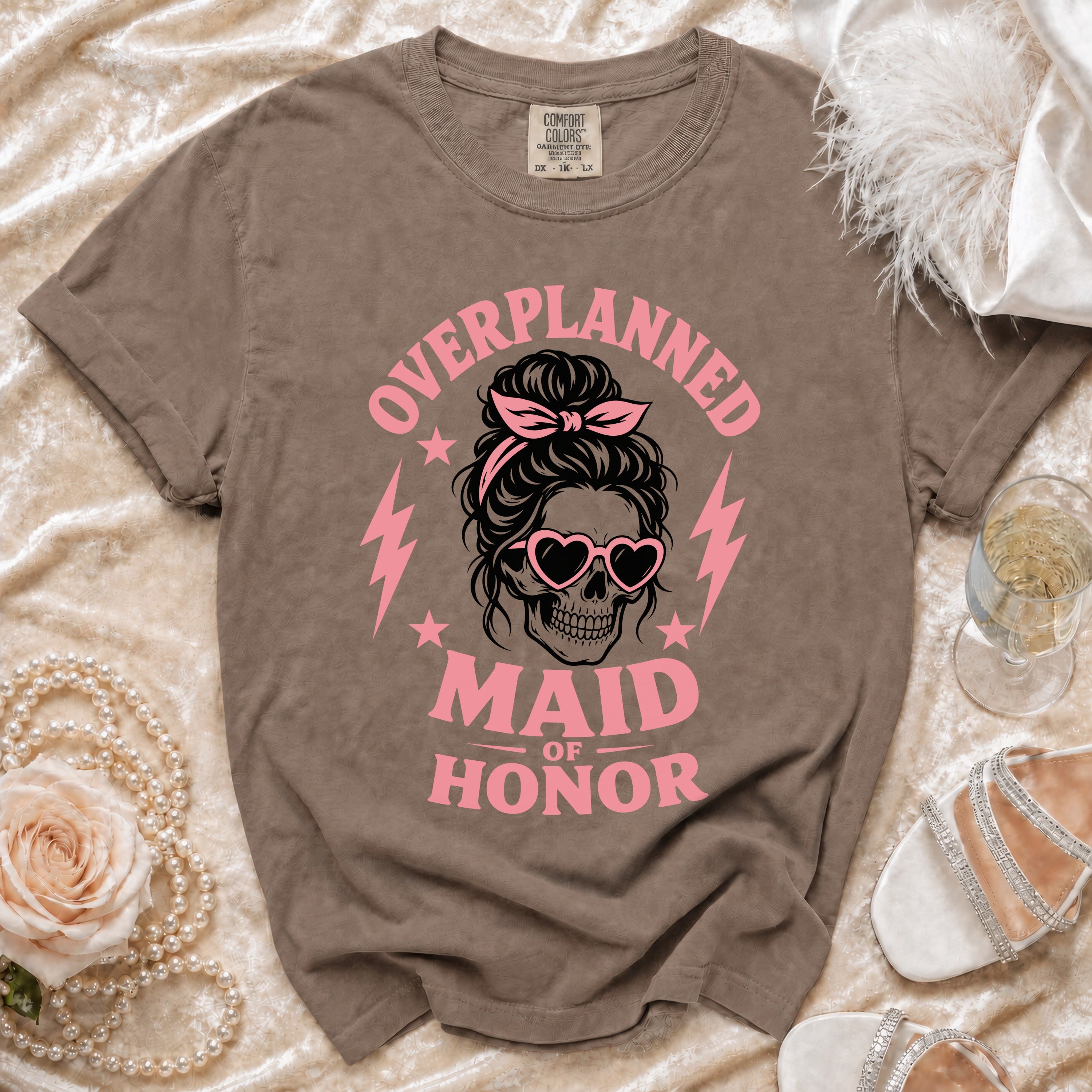 Brown t-shirt with "Overplanned Maid of Honor" text and skull graphic.