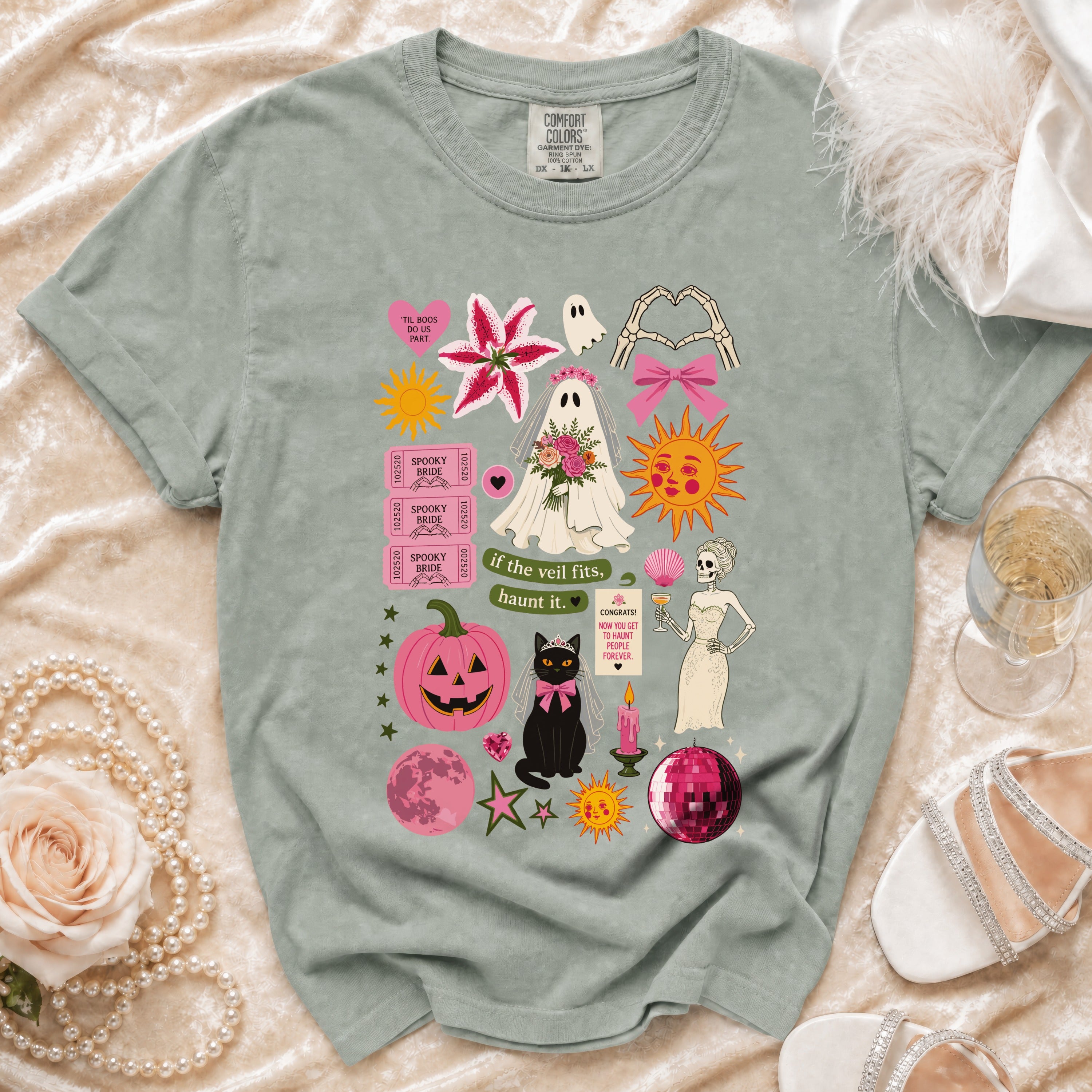 T-shirt with ghost bride, cat, skeleton, pumpkin, and "if the veil fits, haunt it" text.