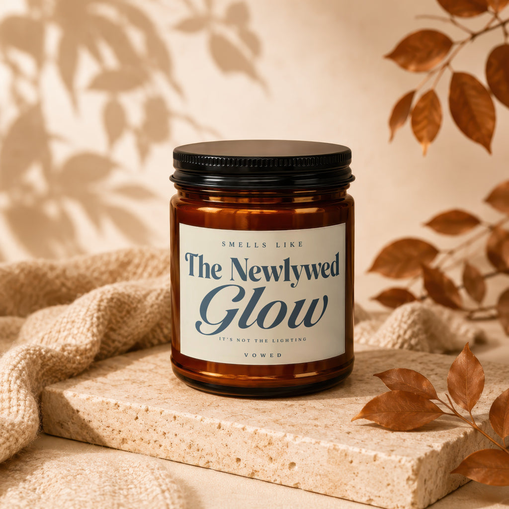 Brown glass candle with "The Newlywed Glow" label, Vowed.