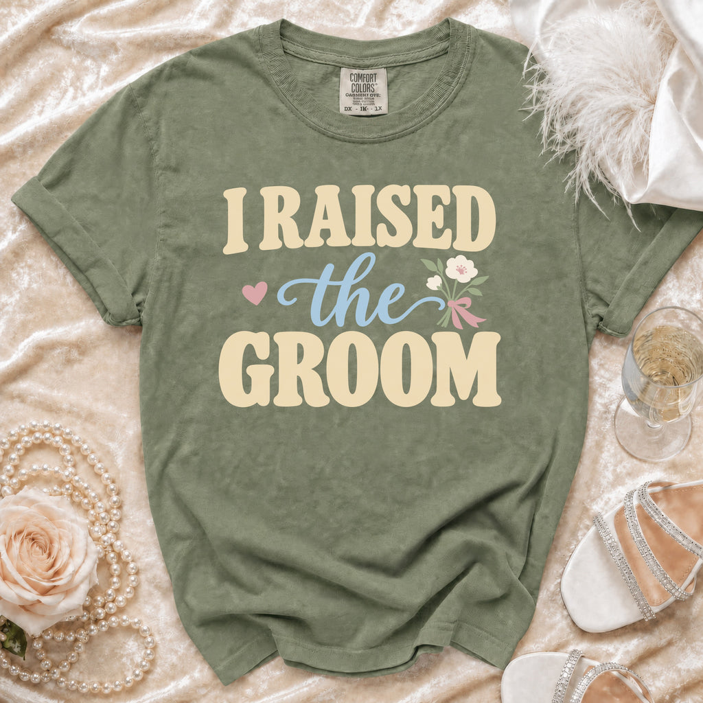 Olive green t-shirt with "I RAISED the GROOM" text and floral graphic.