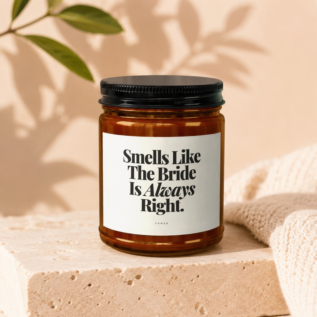 Amber glass candle with black lid and "Smells Like The Bride Is Always Right" text.