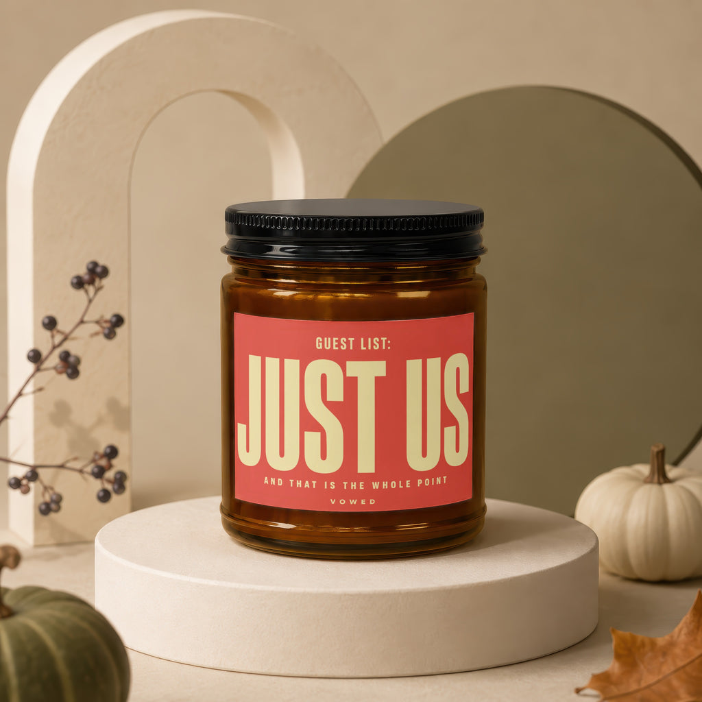 Amber jar candle with "Guest List: Just Us" text, surrounded by decorative elements.