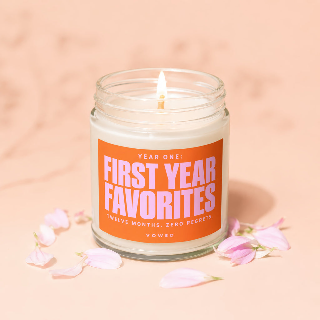 Scented candle with text "Year One: First Year Favorites" and "Twelve Months. Zero Regrets." Vowed.