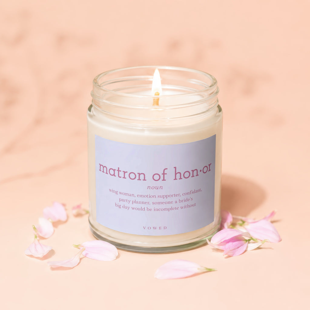 Candle with "matron of honor" definition label.
