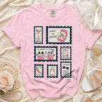 Pink t-shirt with stamp-like graphics detailing maid of honor duties and phrases.